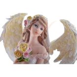Fehér angyal szobor virágokkal